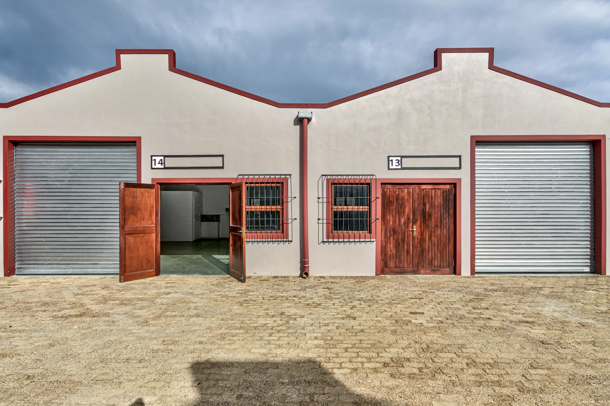 Units 13 and 14, with roller doors and open timber doors
