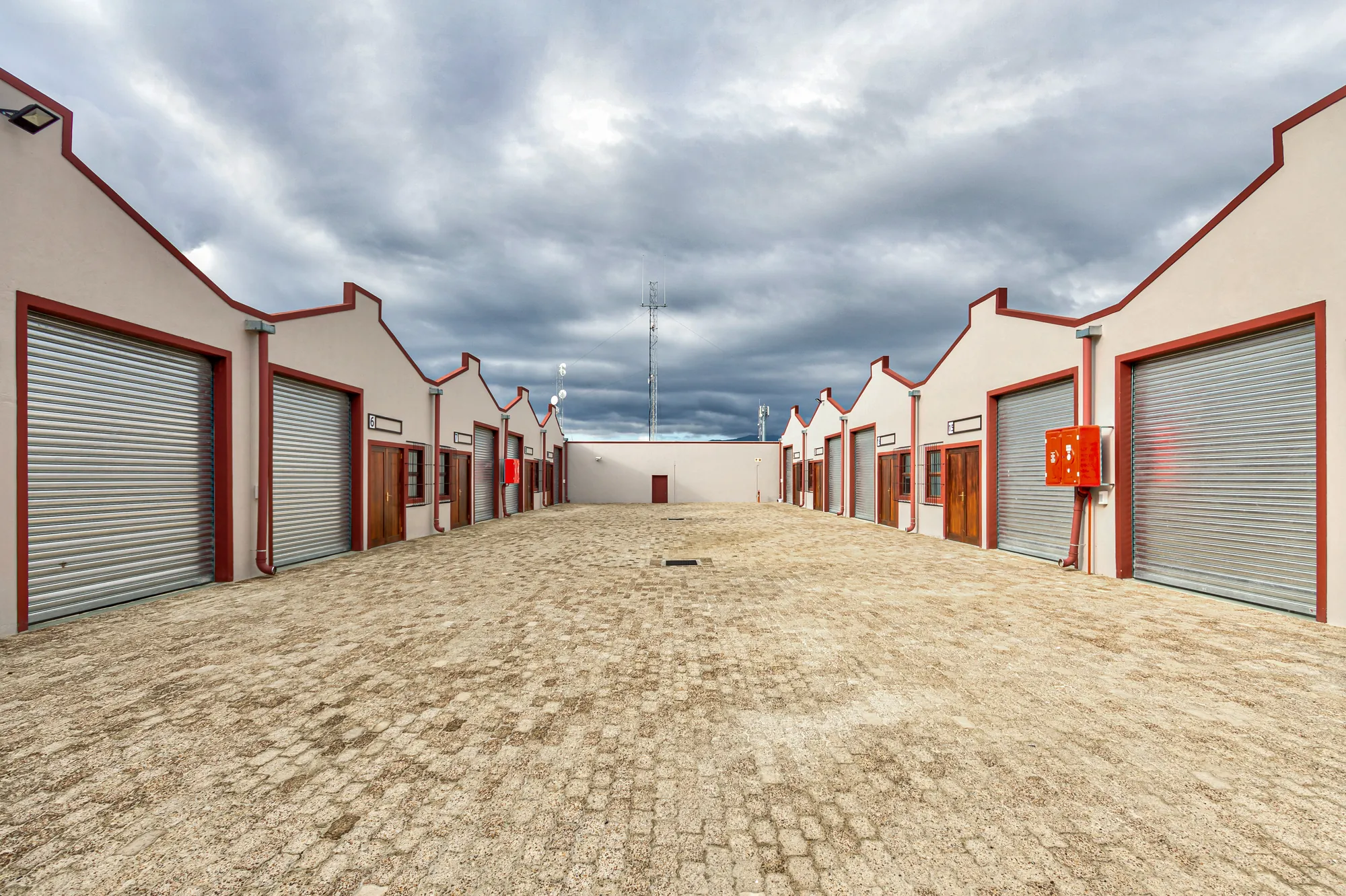 Two rows of units facing each other across the paved yard at Platinum Park