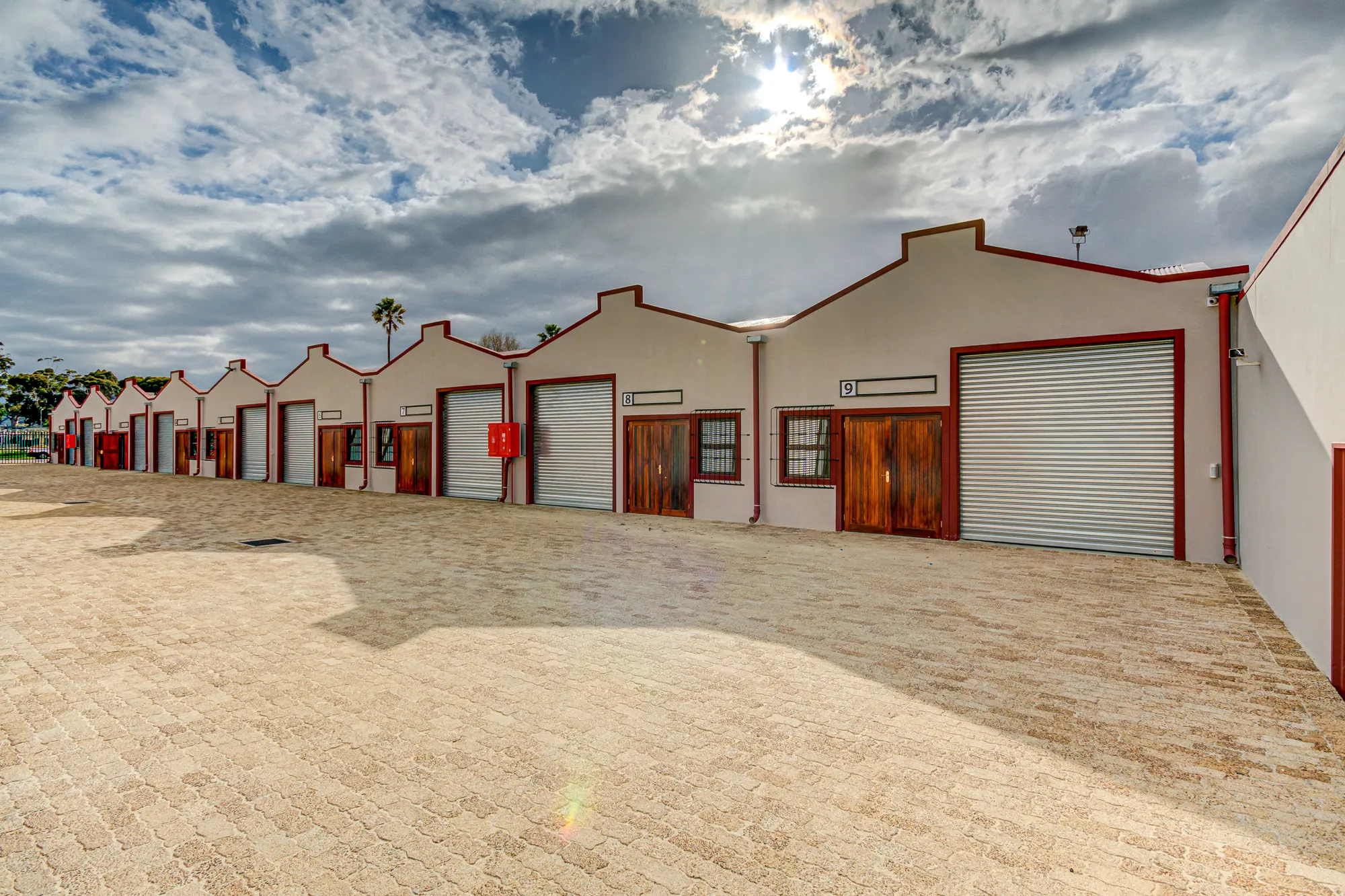 The long row of units under a cloudy sky